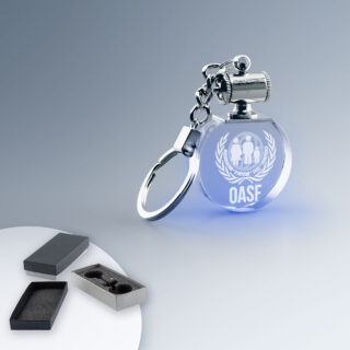 Porte Clé Lumineux Personnalisé Rond en verre avec éclairage bleu, choix idéal pour goodies et objets publicitaires